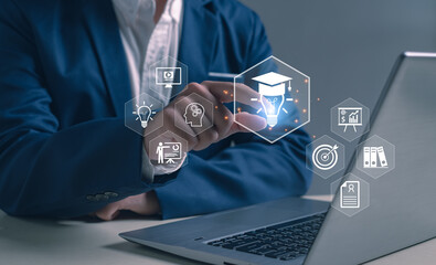 Businessman touching virtual education icons on digital interface, symbolizing online learning, innovation, e-learning technology, smart education, academic knowledge, and modern training concepts.