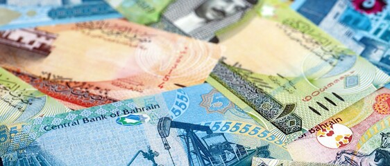 Bahraini dinar currency money bills. The current banknotes lies on table in big amount close up
