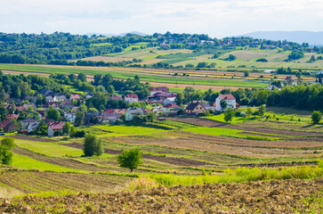 Scenic village nestled in rolling farmland vista