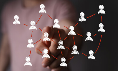 Hand pointing at network connection diagram.  Illustrates teamwork, collaboration, and global...