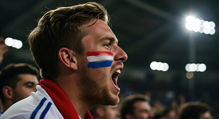 Man with Dutch flag colors on face cheering loudly in crowded stadium. Passionate soccer fan supporting national team during match. Excitement of sports event and fan enthusiasm concept.