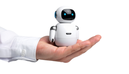 A person holding a small, friendly-looking robot