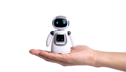 A hand holding a cute little robot, a symbol of technology and artificial intelligence
