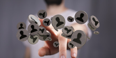 A modern human resources concept of networking and social media connection with a finger pointing to floating contact icons.