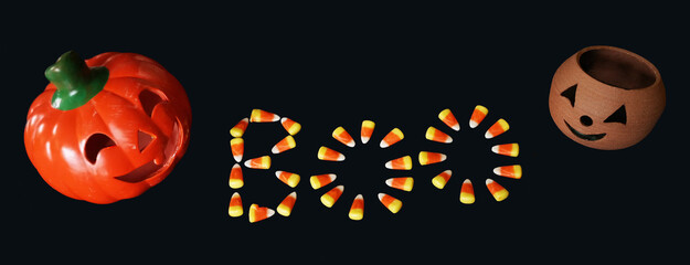 Candy corn and jack-o-lanterns create an image for Autumn and Halloween