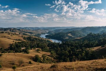 Fototapeta premium aerial view of landscape with rolling hills, green forests, a blue river with white stars