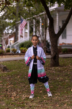 A child wearing a detailed Halloween costume inspired by animi characters.