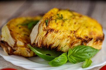 Baked cabbage wedges in crispy golden batter with herbs