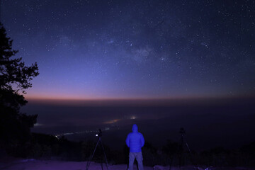 Obraz premium Milky way galaxy at night. Image contains noise and grain due to high ISO. Image also contains soft focus and blur. The Milky Way is our galaxy.