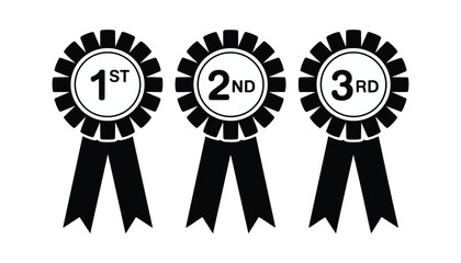 Three black rosettes with ribbons displaying 1st 2nd and 3rd place text award first place