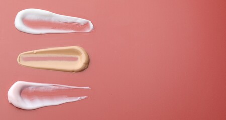 Samples of cosmetic product on color background, closeup. Space for text