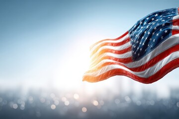 Waving American flag against a light blue sky and bokeh city background, symbolizing freedom, democracy and patriotism with red, white and blue colors.