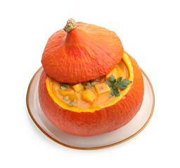 Tasty pumpkin cream soup with seeds and parsley in pumpkin isolated on white