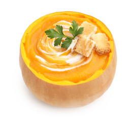 Tasty pumpkin cream soup with croutons and parsley in pumpkin isolated on white