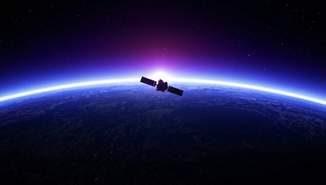 A satellite orbiting the earth with the sun rising over the horizon