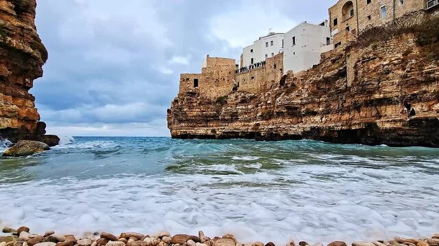 View from the pebble beach of the bay and sea in Polignano a Mare, Italy, Europe.