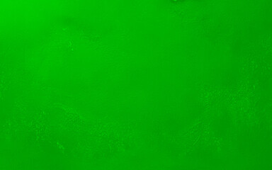 Close-up of a green textured wall with a rough and uneven surface. Perfect for use as a background, texture, or design element.