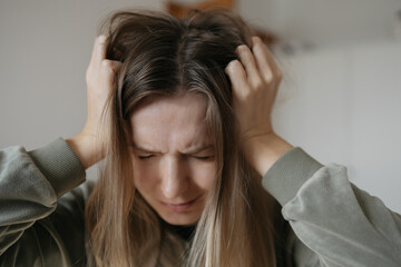 Young woman has hair loss problem Care shampoo for repairing thin hair Avitaminosis, anaemia problem