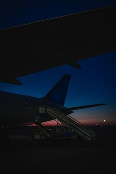 Airplane on Runway at Sunrise &ndash; Aviation and Travel Concept