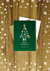 A wooden vertical surface decorated with Christmas decorations, a holiday card lies on the table, creating a warm festive atmosphere