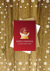 A wooden vertical surface decorated with Christmas decorations, a holiday card lies on the table, creating a warm festive atmosphere