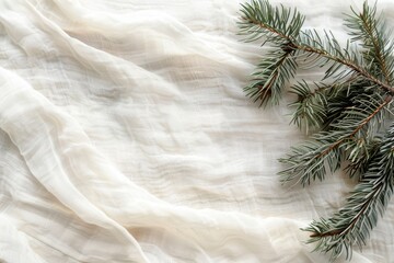 White cloth with a pine tree branch on it