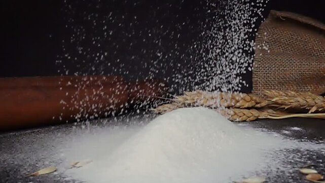 wholewreat flour spills onto rustic table adorned with wheat ears and rolling pin, capturing essence of baking and culinary traditions in cozy kitchen, baking concept, super slow motion