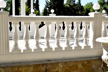 Unique architecture. Antique balcony with marble balustrades.