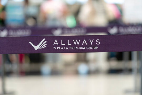 Close up of ALLWAYS by Plaza Premium Group sign on retractable belt barrier