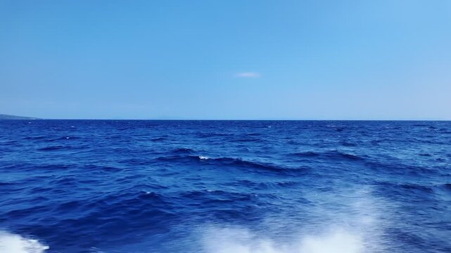 captivating view, showcasing strong pitching, high waves and vibrant white foam splashing against hull in turbulent waters, slow motion