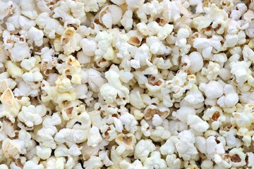 Popcorn texture background. Big amount of popcorn as pattern photo