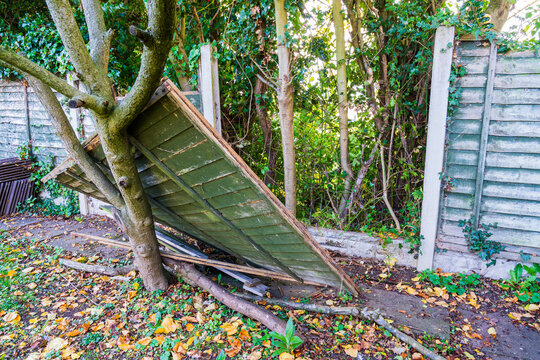 Fence panel damage after a storm, high winds and bad weather cause demolition to garden fencing
