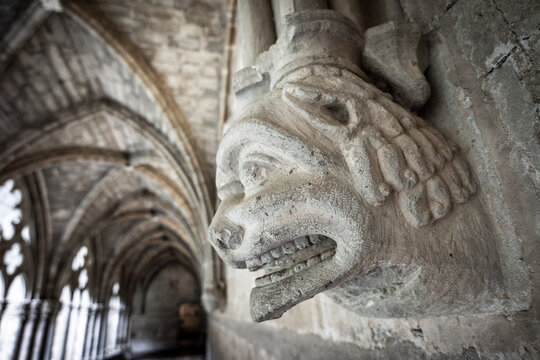 Atlas and human faces of the corbels, cloister of Royal monastery of Santa Mar&iacute;a de Veruela, 12th century Cistercian abbey, Vera de Moncayo, Zaragoza province, Spain