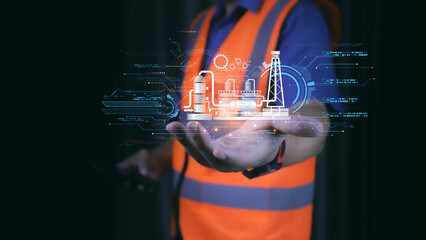 Futuristic concept of smart industry with engineer using digital hologram interface for factory automation, data analysis, and industrial innovation in modern manufacturing technology.