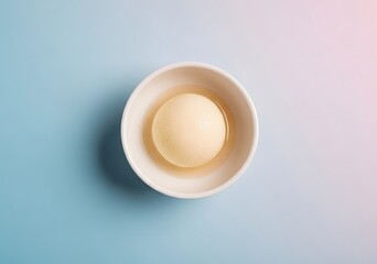 Rasgulla in a bowl isolated on blue background, a traditional indian sweet delicacy served in syrup