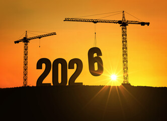 Silhouette of cranes building the number 2026 at sunset, symbolizing progress, construction, and the beginning of a new year filled with hope, growth, and opportunities for the future. 2026, creative