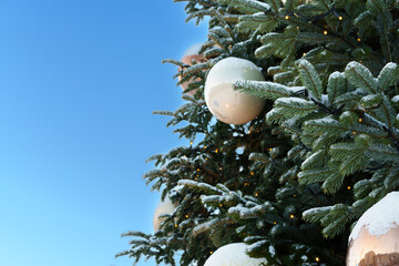 Festive Christmas Tree Decoration Against Clear Blue Sky
