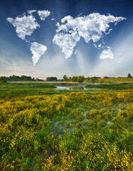 Fototapeta premium World Map Clouds Over Morning Meadow