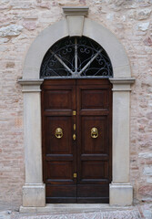 Elegant Historic Wooden Double Door Arch Stone Frame Wrought Iron Grille