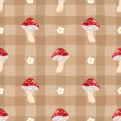 Seamless vector pattern with fly agaric mushrooms on a checkered gingham background, decorated flowers. Rustic woodland theme, suitable for fabric, wallpaper, wrapping, seasonal decor