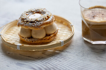 Close-Up of Pistachio and Pumpkin Christmas Paris-Brest Dessert with Pumpkin Latte
