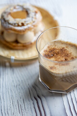 Close-Up of Pistachio and Pumpkin Christmas Paris-Brest Dessert with Pumpkin Latte
