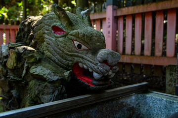 Fototapeta premium Dragon statue guarding fountain