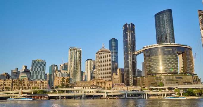 4K left to right panning Time Lapse motion view of Brisbane Central Business District in very late afternoon light featuring  the new Neville Bonner Bridge, Brisbane, Queensland, Australia