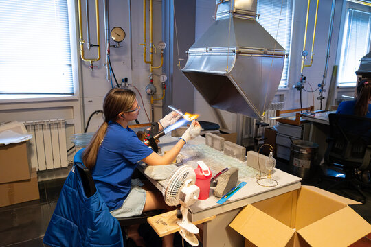 Glassblowing demonstration in a studio with an artisan shaping molten glass making a Christmas tree decoration in the city of Nizhny Novgorod, Russia - October 10, 2025