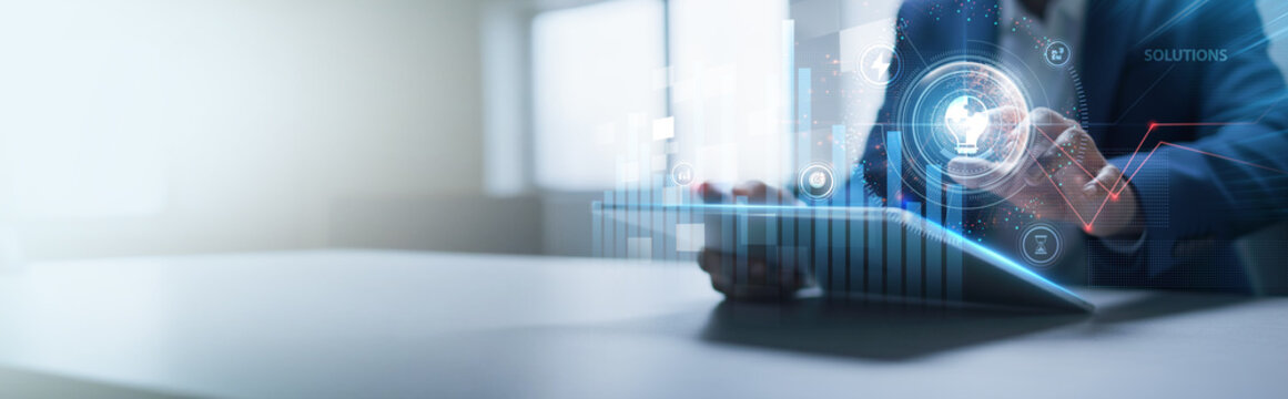 Businessman analyzing structured graph charts and tablet data of business solutions, strategic planning, digital transformation, process improvement, innovation systems, and efficiency management.