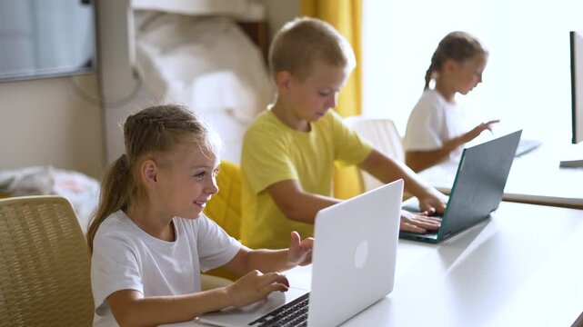 Children use laptop for group learning, kid interact with computer in classroom, study and education blend with technology and school task, collaborative learning and playful coding practice