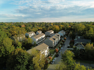 New luxury townhomes surrounded by Fall foliage in Raleigh , North Carolina