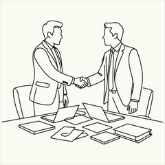 Two businessmen shaking hands over a table with laptops and documents outline