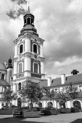 baroque buildings with belfry of a former monastery on a sunny day in Poznan
